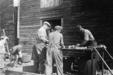 023: "Splitting fish at Dunphy's wharf, Red Island". l-r at table Bill Webber, Mike Reddy, Tom Dunphy; J V McCarthy is behind the table with pipe. Boys at left are Kevin Carroll and Joe Dunphy. (circa 1943)- Bill son of John Webber &amp;amp; Mary Emberley; Mike son of James Reddy &amp;amp; Mary Anne Murphy; Tom son of Patrick Dunphy &amp;amp; Anastasia Fitzgerald McCarthy; J V son of Thomas McCarthy &amp;amp; Anastasia Fitzgerald; Kevin son of Michael Carroll &amp;amp; Josie Barry; Joe son of Thomas Dunphy &amp;amp; Anne Carroll.